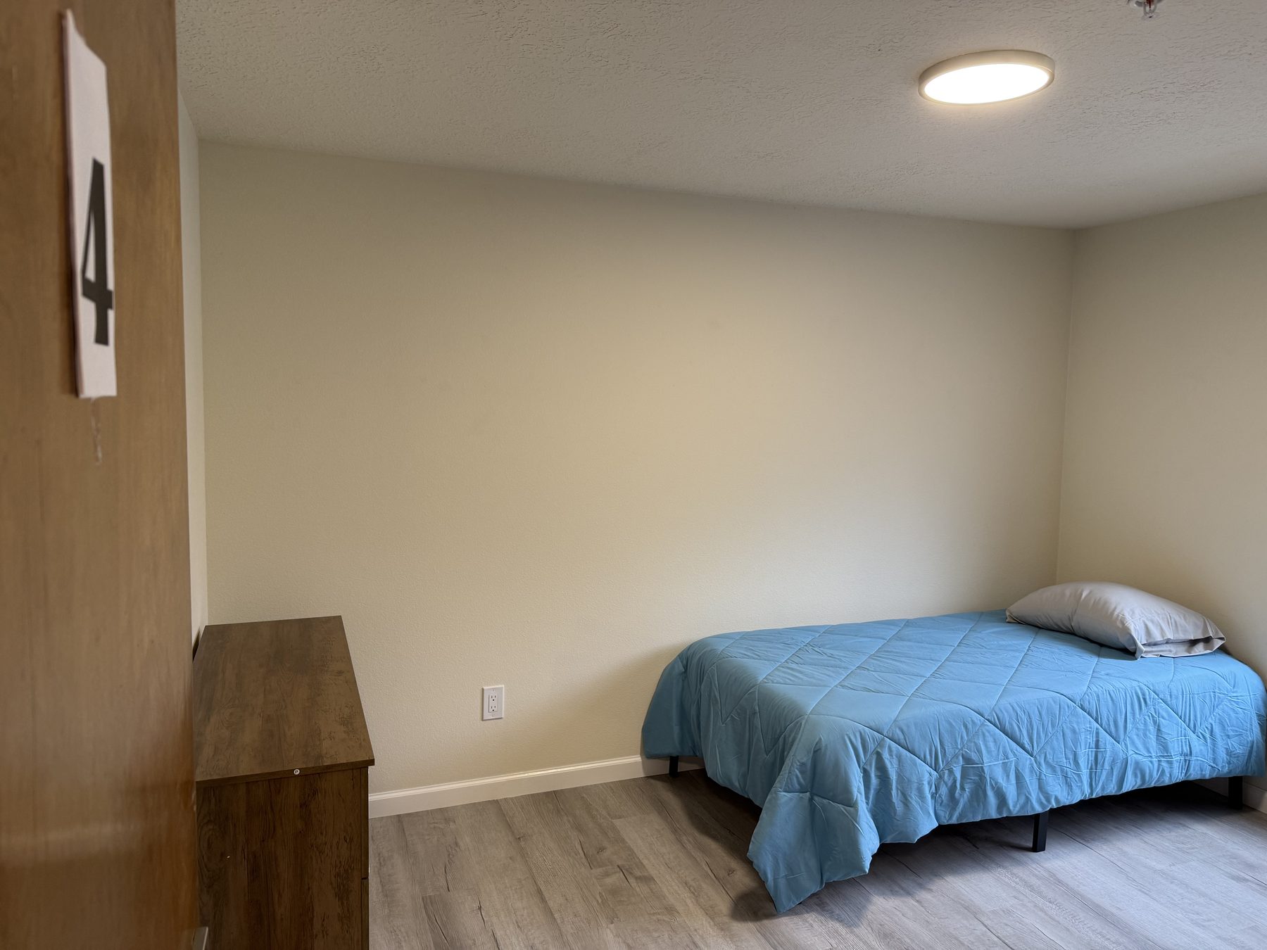 Private bedroom with blue bedding
