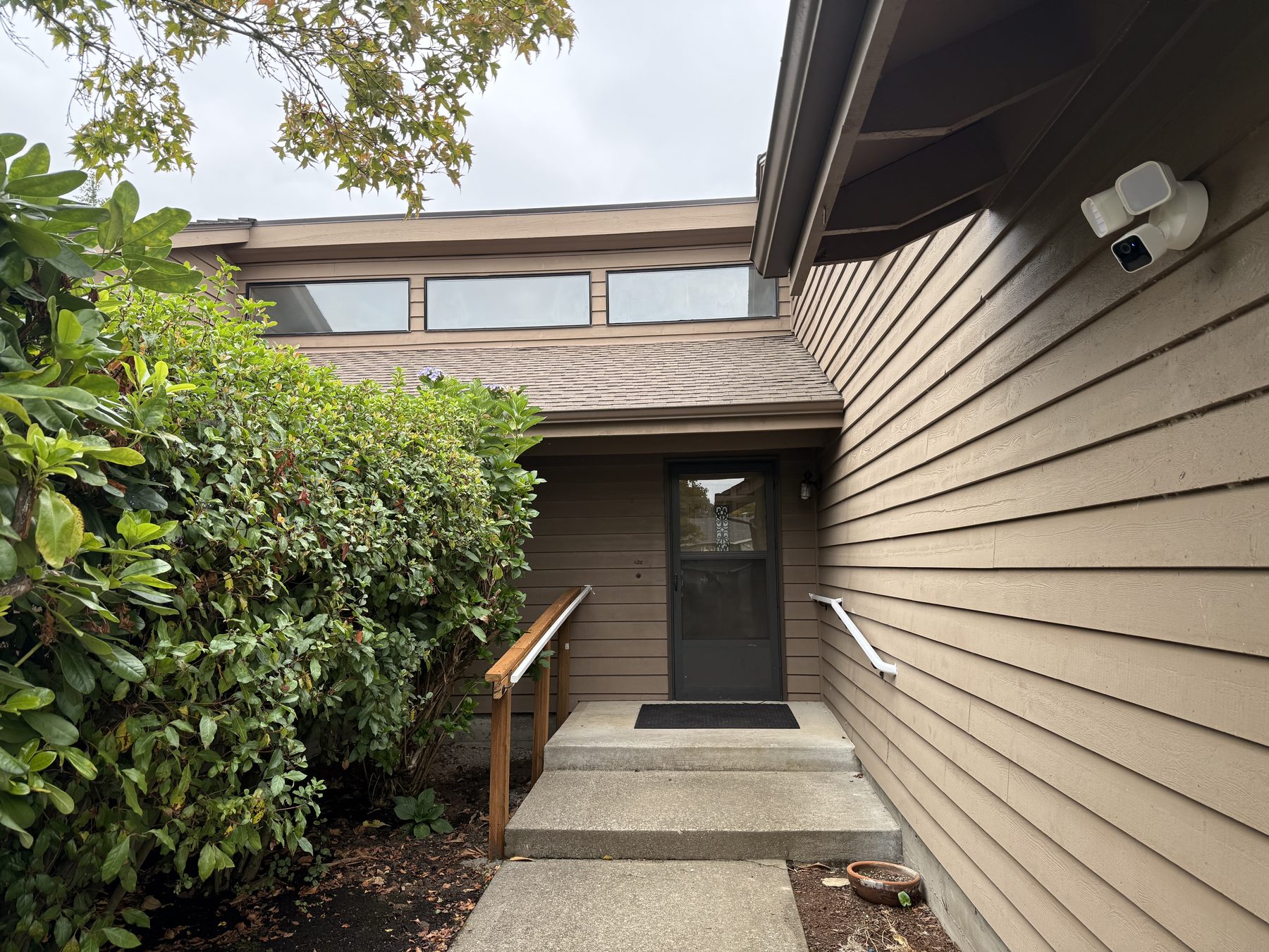Front entrance with lighting and camera